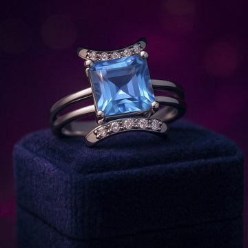 Emerald cut blue topaz & diamond cocktail ring in 10k yellow gold