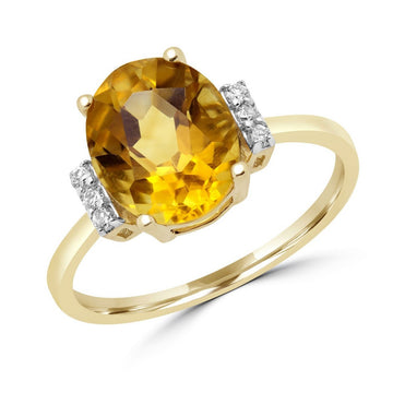 Fancy oval citrine and diamond in yellow gold
