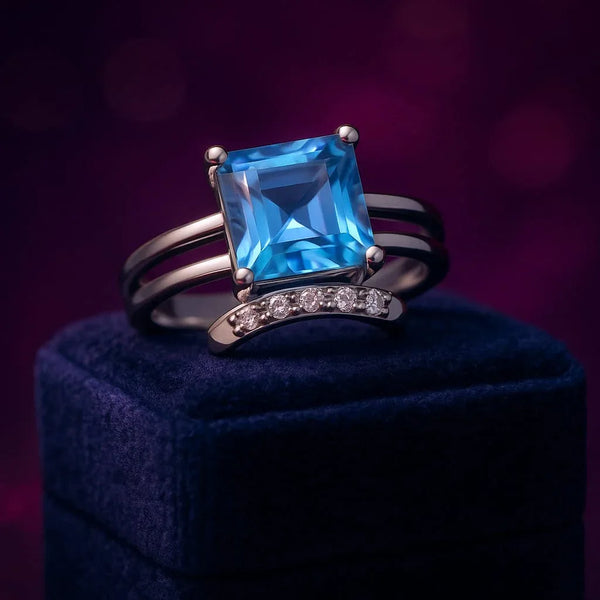 Blue topaz & diamond cocktail ring in 10k white gold