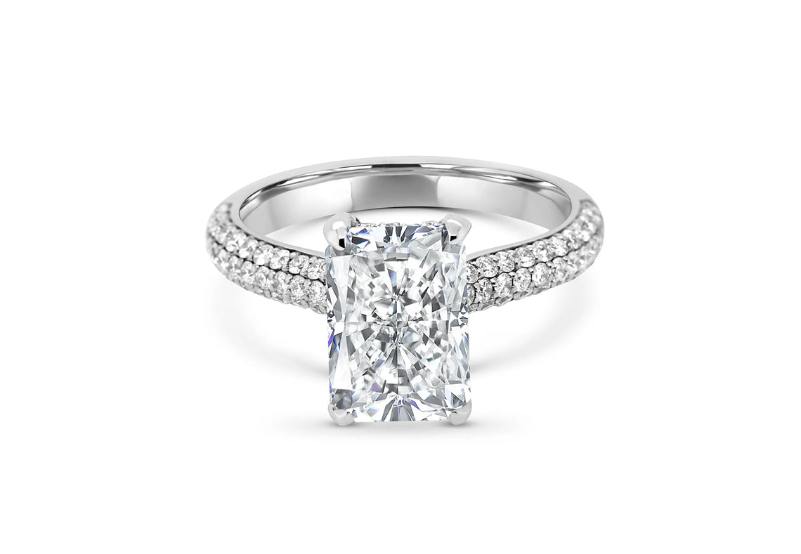 Radiant-cut diamond ring with a diamond-set band